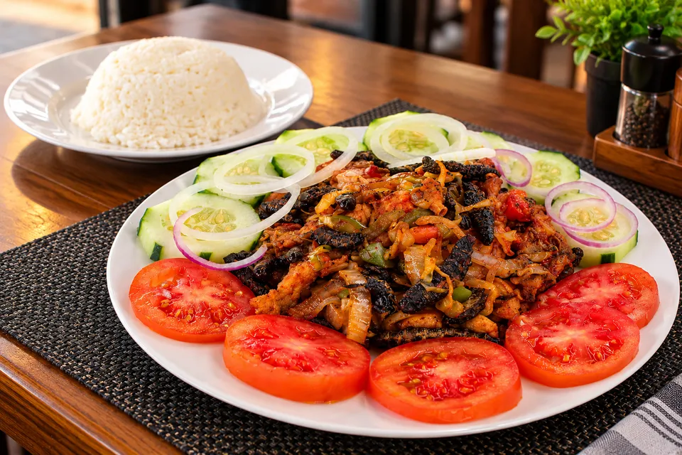 A hearty plated meal with fresh vegetables and rice